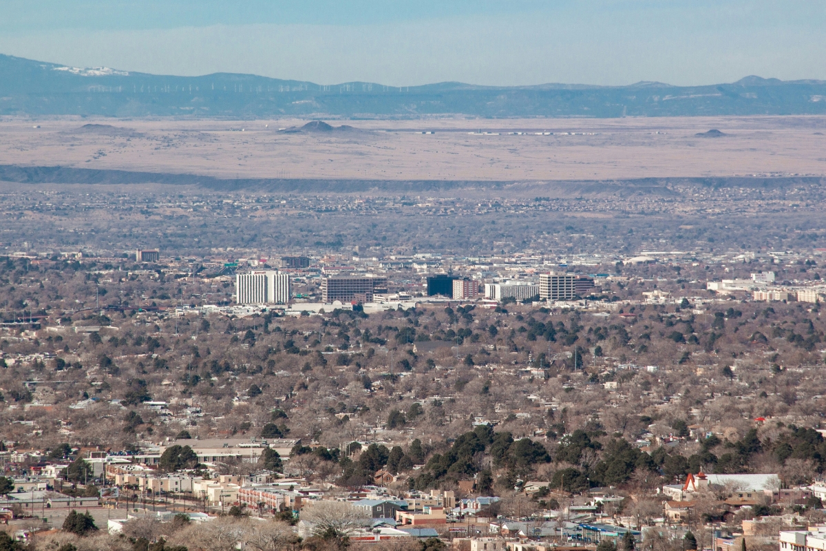 Panoramic view of Albuquerque, New Mexico with residential areas in the foreground and Sandia Mountains in the distance