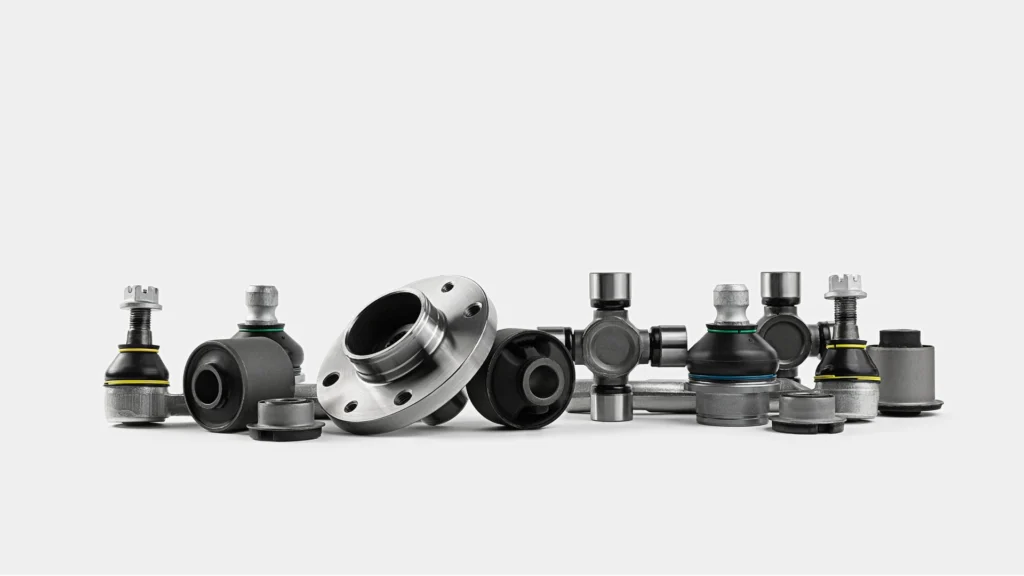 Small precision metal components used in metal injection molding applications on a clean white background.