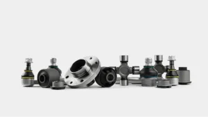 Small precision metal components used in metal injection molding applications on a clean white background.