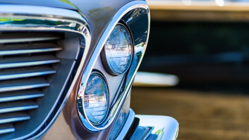 Clear polycarbonate automotive headlamp lens showing optical clarity and impact resistance