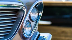 Clear polycarbonate automotive headlamp lens showing optical clarity and impact resistance