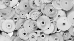 White Delrin acetal gears used in precision mechanical applications