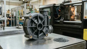 Injection molded PPS pump housing with glass-filled resin pellets in a manufacturing environment